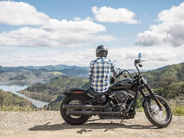 photo of man on motorcycle