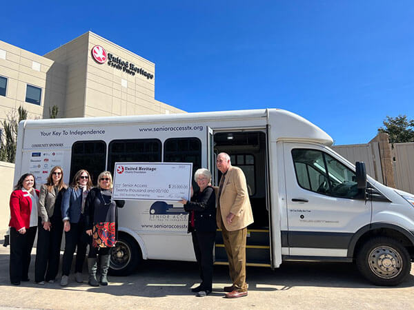 Senior Access and UHCF Board members with check