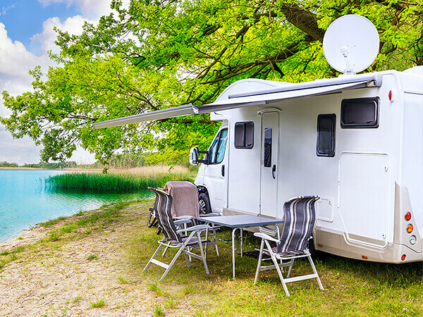 image of rv by lake